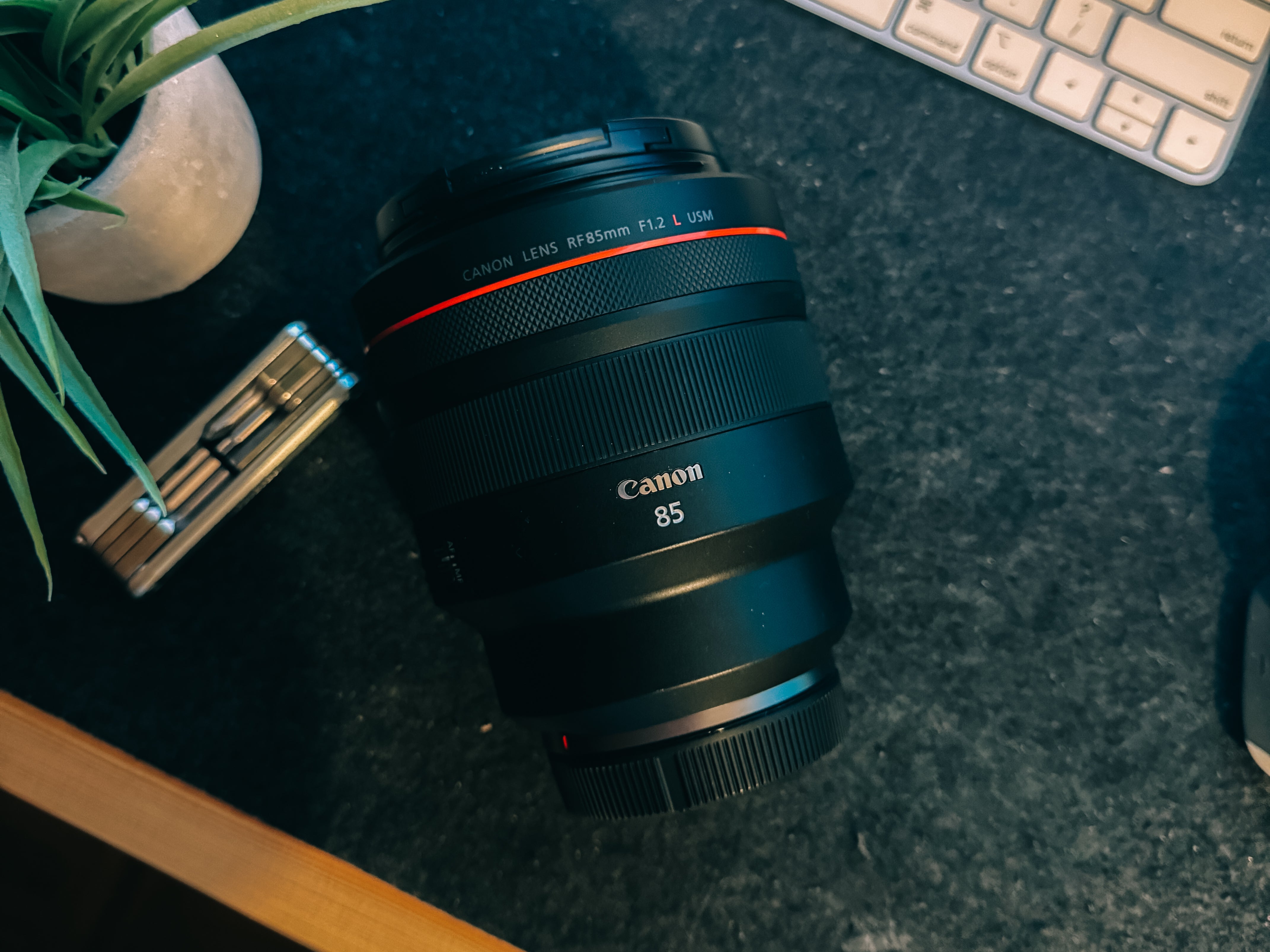 Canon RF 85mm f/1.2L USM lens front view with red ring design, ideal for portrait photography.